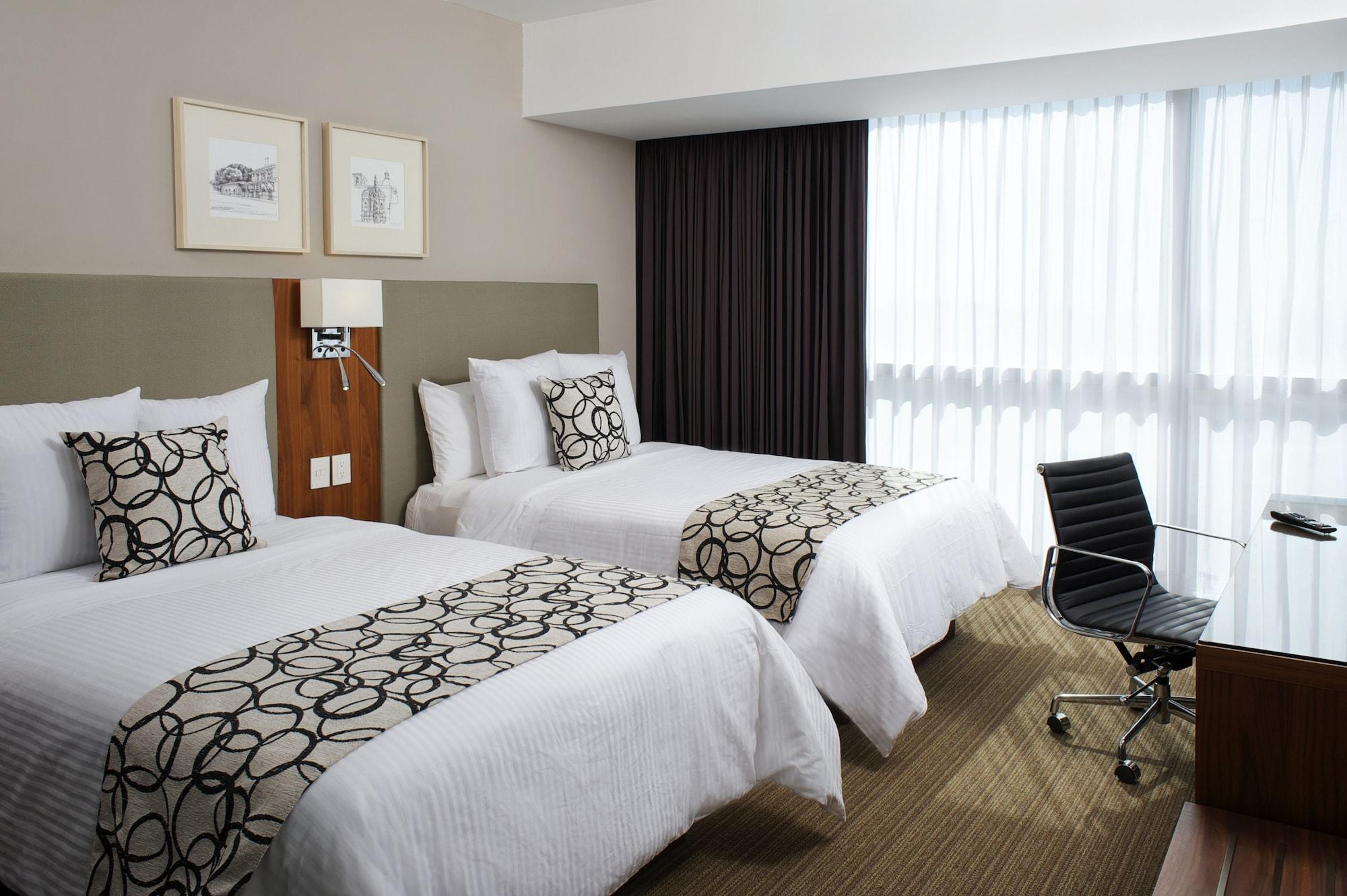 Casa Inn Premium Hotel 케레타로 외부 사진 A room at the hotel